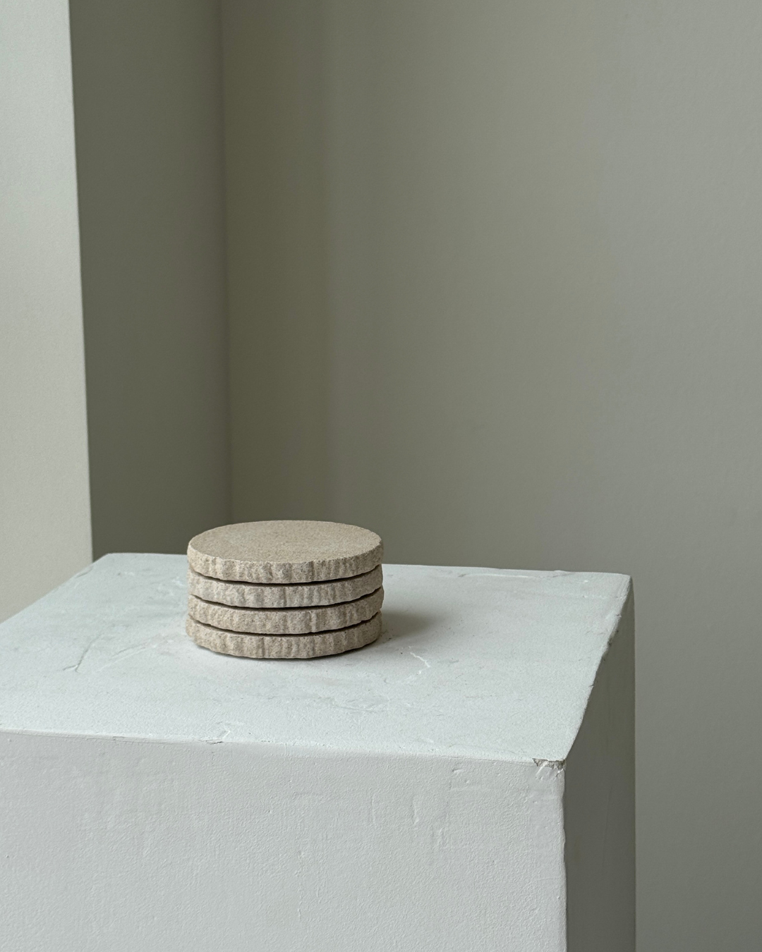 hand-poured micro concrete coasters, modern almond beige stone-look finish, minimalist drink coasters, functional and stylish drink accessories, high-quality concrete home decor, eco-friendly coaster set, contemporary table decor, unique coasters for home, sustainable coasters for drinks, premium concrete drinkware, handmade coasters for dining or living room, versatile coaster set for glass, mug, or cup, perfect gift for home decor lovers, elegant and durable home accessories, ginaladeco