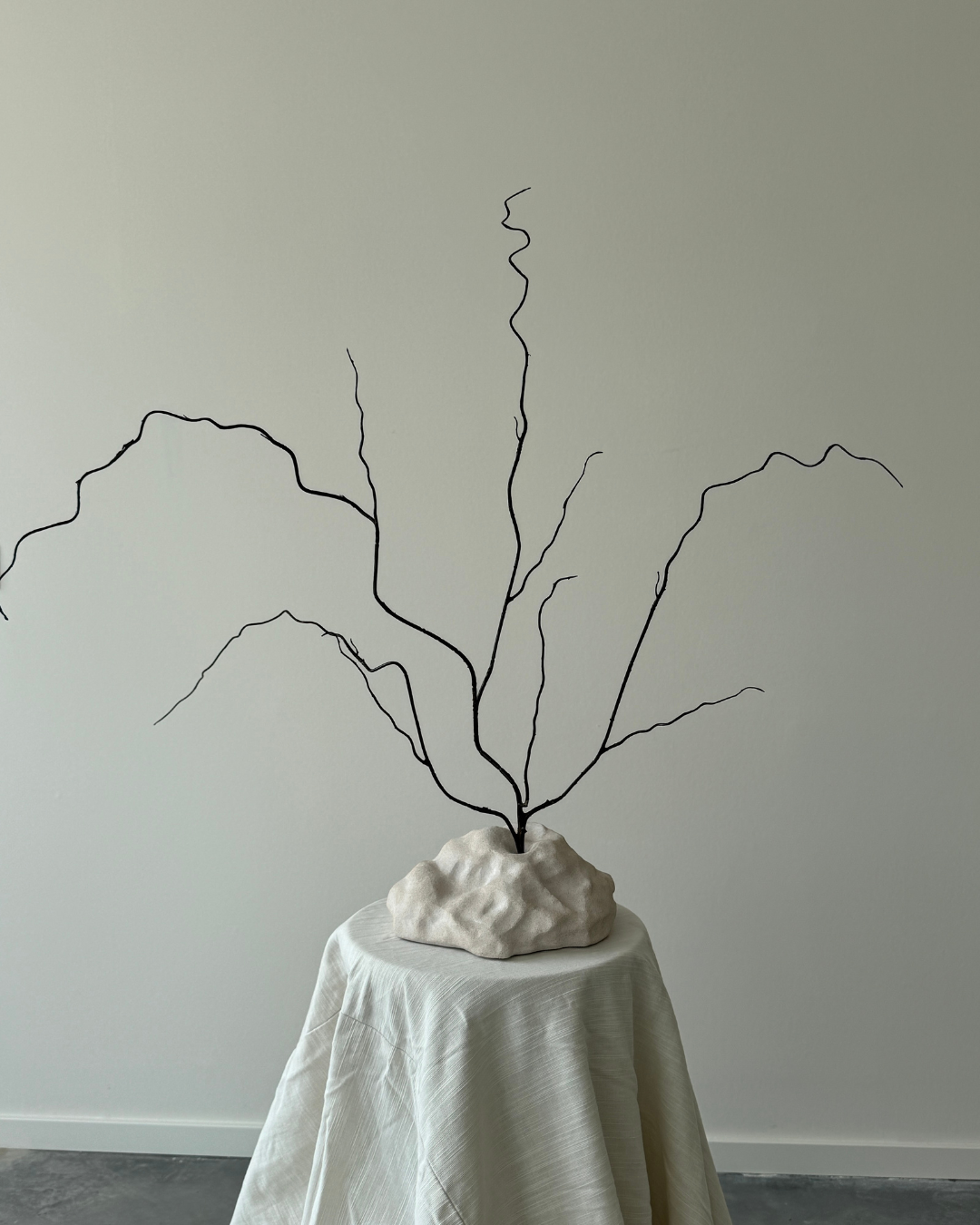 hand-poured micro concrete sculpture, modern minimalist art piece, unique concrete decor, sculptural home accent, almond beige stone-look finish, functional art object, vase for single branch or stem, contemporary decor for living room or office, eco-friendly sculptural piece, high-quality concrete art, handmade decor for modern homes, statement art piece, functional decorative sculpture, versatile decor for floral arrangements, premium home decor, bespoke design sculpture, handmade art for home styling, gi