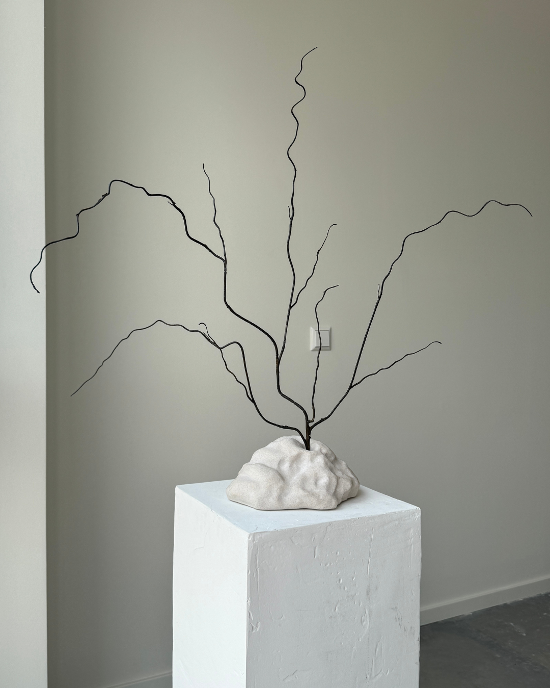 hand-poured micro concrete sculpture, modern minimalist art piece, unique concrete decor, sculptural home accent, almond beige stone-look finish, functional art object, vase for single branch or stem, contemporary decor for living room or office, eco-friendly sculptural piece, high-quality concrete art, handmade decor for modern homes, statement art piece, functional decorative sculpture, versatile decor for floral arrangements, premium home decor, bespoke design sculpture, handmade art for home styling, gi