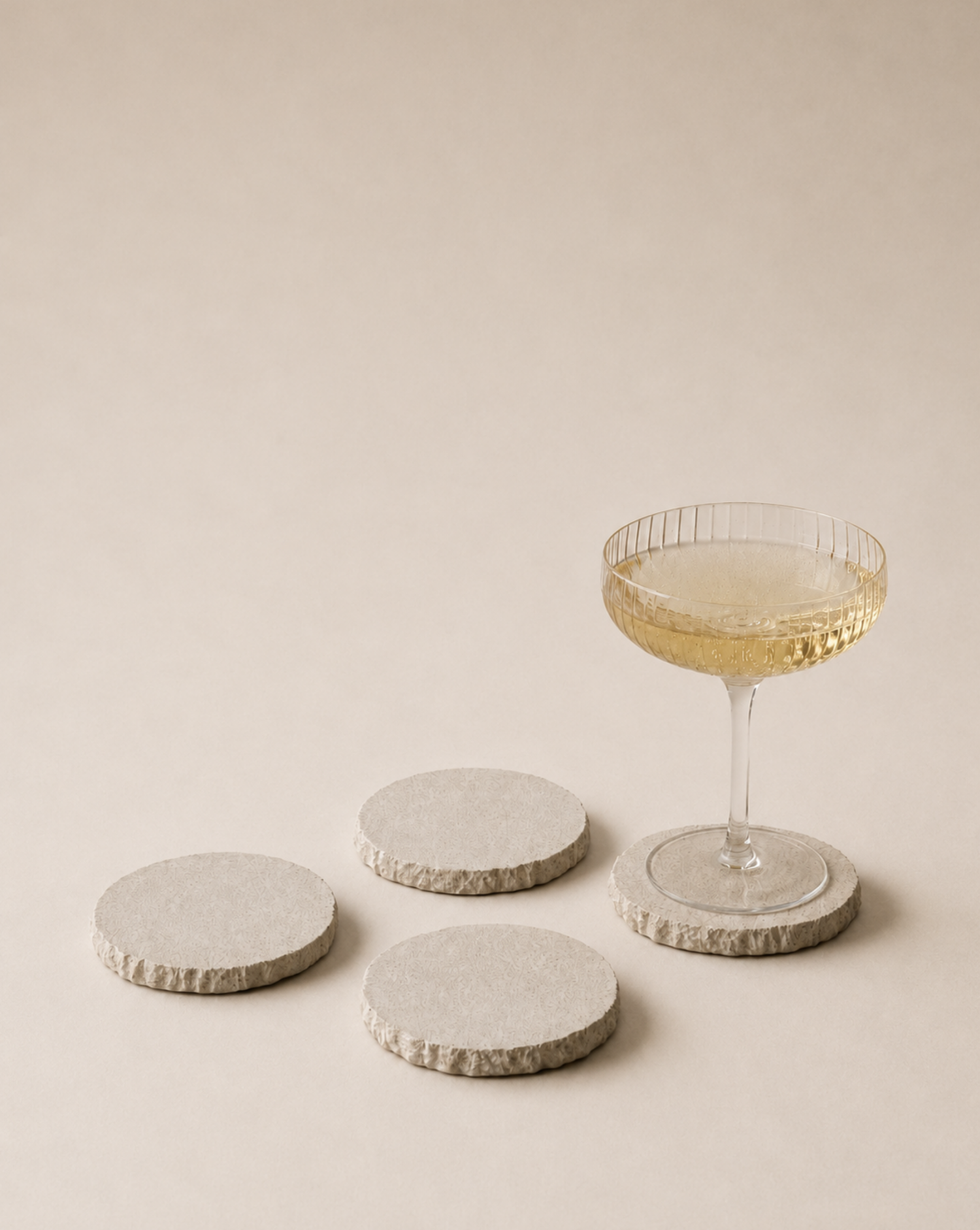hand-poured micro concrete coasters, modern almond beige stone-look finish, minimalist drink coasters, functional and stylish drink accessories, high-quality concrete home decor, eco-friendly coaster set, contemporary table decor, unique coasters for home, sustainable coasters for drinks, premium concrete drinkware, handmade coasters for dining or living room, versatile coaster set for glass, mug, or cup, perfect gift for home decor lovers, elegant and durable home accessories, ginaladeco