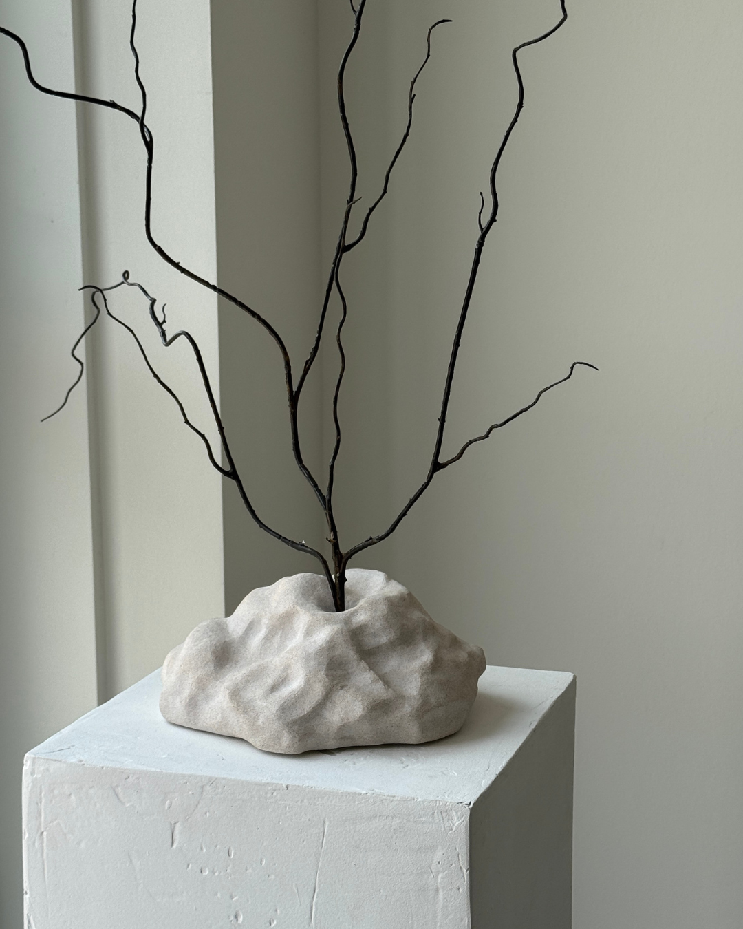 hand-poured micro concrete sculpture, modern minimalist art piece, unique concrete decor, sculptural home accent, almond beige stone-look finish, functional art object, vase for single branch or stem, contemporary decor for living room or office, eco-friendly sculptural piece, high-quality concrete art, handmade decor for modern homes, statement art piece, functional decorative sculpture, versatile decor for floral arrangements, premium home decor, bespoke design sculpture, handmade art for home styling, gi