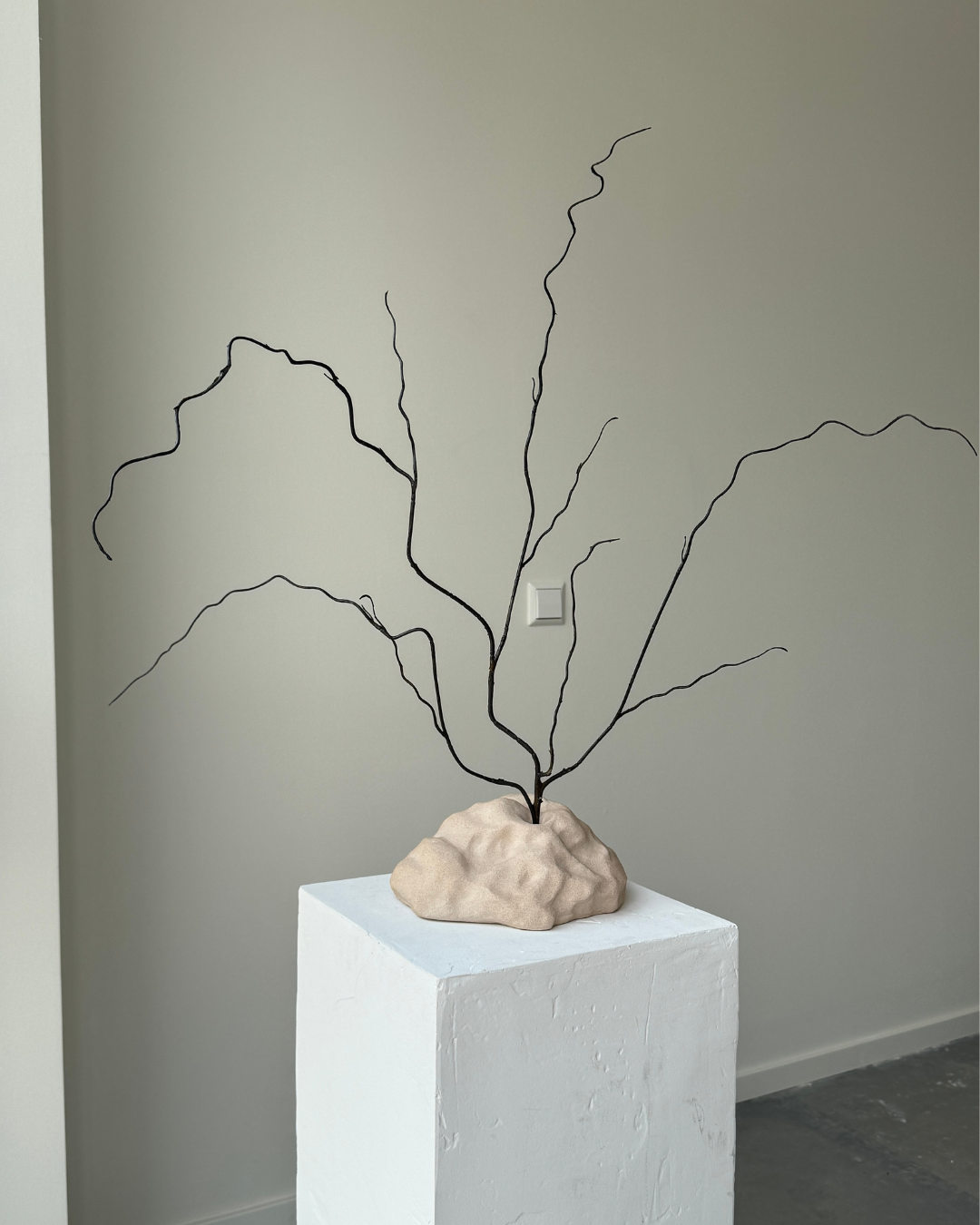 hand-poured micro concrete sculpture, modern minimalist art piece, unique concrete decor, sculptural home accent, almond beige stone-look finish, functional art object, vase for single branch or stem, contemporary decor for living room or office, eco-friendly sculptural piece, high-quality concrete art, handmade decor for modern homes, statement art piece, functional decorative sculpture, versatile decor for floral arrangements, premium home decor, bespoke design sculpture, handmade art for home styling, gi