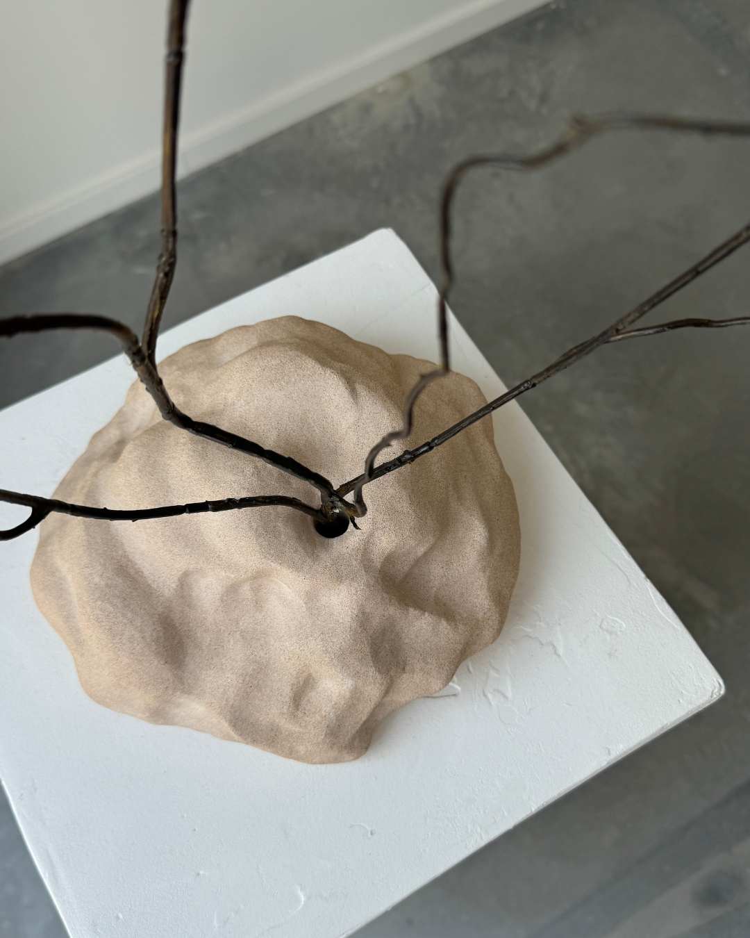 hand-poured micro concrete sculpture, modern minimalist art piece, unique concrete decor, sculptural home accent, almond beige stone-look finish, functional art object, vase for single branch or stem, contemporary decor for living room or office, eco-friendly sculptural piece, high-quality concrete art, handmade decor for modern homes, statement art piece, functional decorative sculpture, versatile decor for floral arrangements, premium home decor, bespoke design sculpture, handmade art for home styling, gi