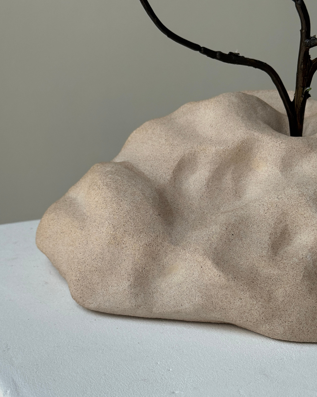 hand-poured micro concrete sculpture, modern minimalist art piece, unique concrete decor, sculptural home accent, almond beige stone-look finish, functional art object, vase for single branch or stem, contemporary decor for living room or office, eco-friendly sculptural piece, high-quality concrete art, handmade decor for modern homes, statement art piece, functional decorative sculpture, versatile decor for floral arrangements, premium home decor, bespoke design sculpture, handmade art for home styling, gi
