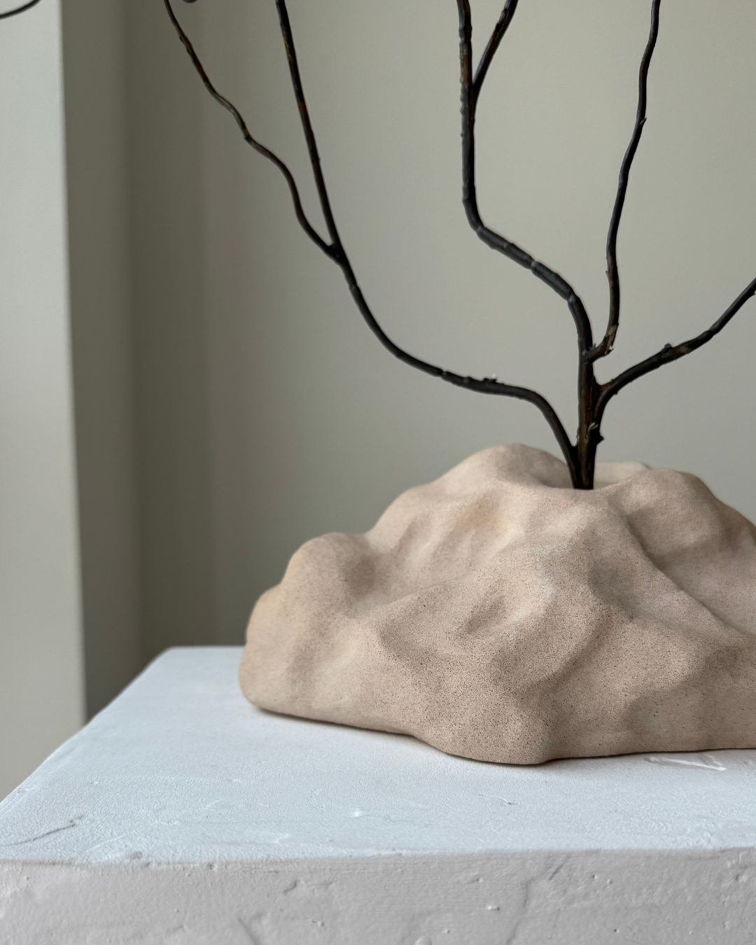 hand-poured micro concrete sculpture, modern minimalist art piece, unique concrete decor, sculptural home accent, almond beige stone-look finish, functional art object, vase for single branch or stem, contemporary decor for living room or office, eco-friendly sculptural piece, high-quality concrete art, handmade decor for modern homes, statement art piece, functional decorative sculpture, versatile decor for floral arrangements, premium home decor, bespoke design sculpture, handmade art for home styling, gi