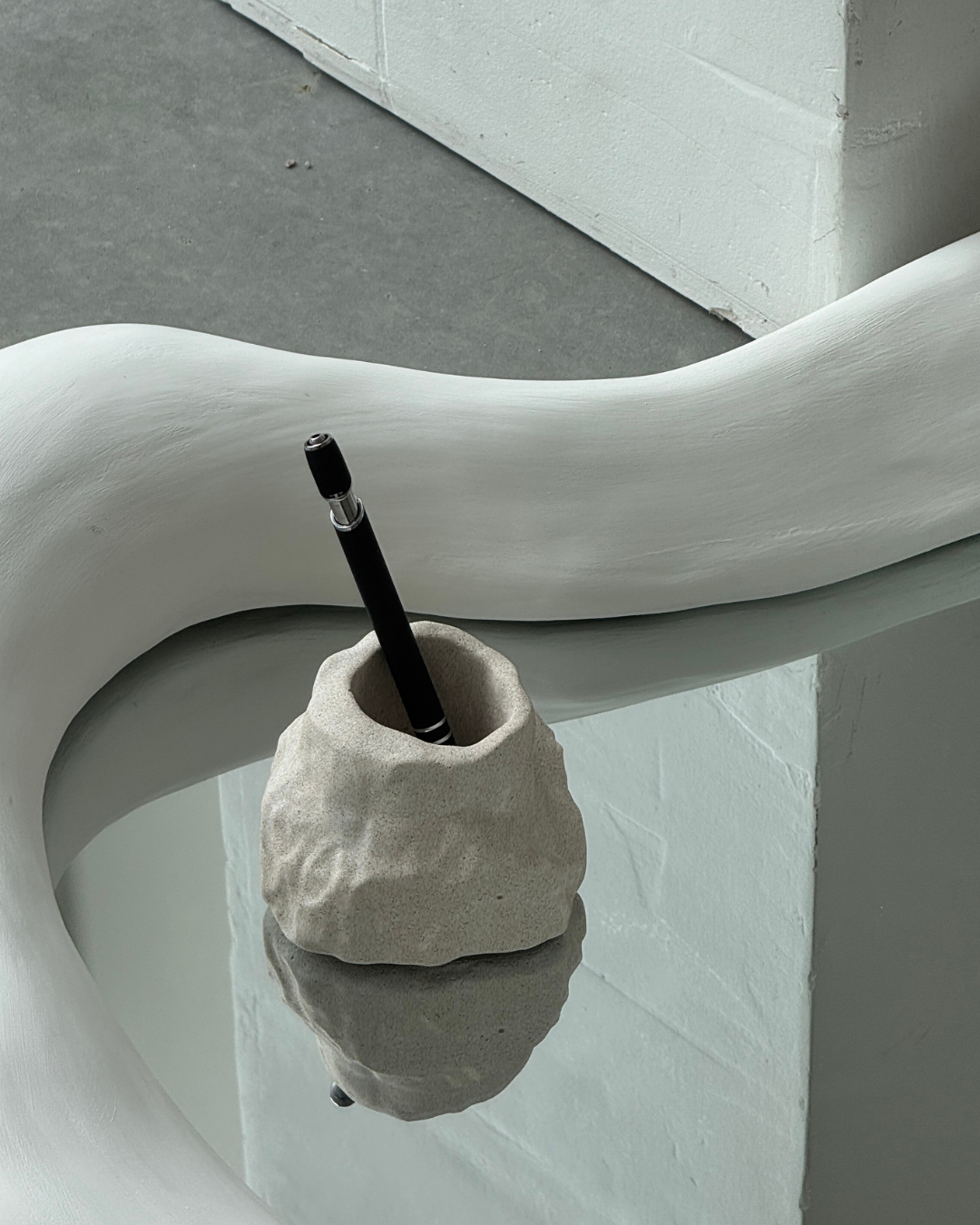 hand-poured micro concrete pen holder, almond beige stone-look finish, modern and minimalist desk organizer, stylish office decor, functional pen holder for home office, unique desk accessory, eco-friendly concrete desk storage, high-quality office supplies, contemporary home decor, versatile storage solution for pens, pencils, and office tools, sculptural office decor, perfect for desk or workspace, gift-ready pen holder, sustainable home office piece, elegant and practical desk organization, ginaladeco