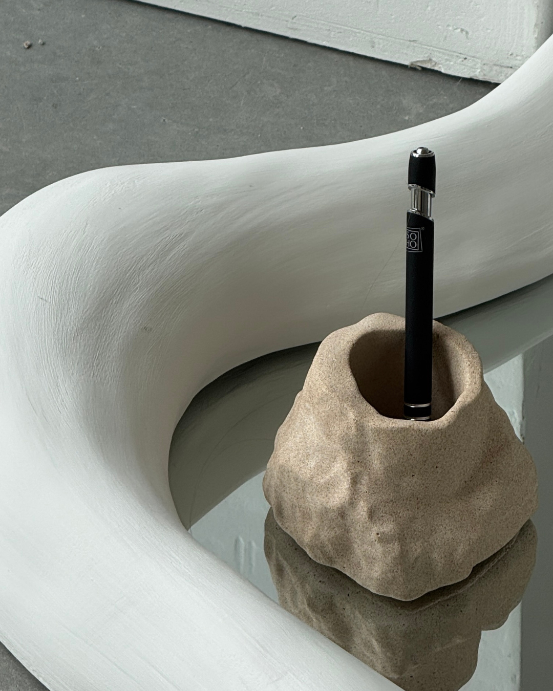 hand-poured micro concrete pen holder, almond beige stone-look finish, modern and minimalist desk organizer, stylish office decor, functional pen holder for home office, unique desk accessory, eco-friendly concrete desk storage, high-quality office supplies, contemporary home decor, versatile storage solution for pens, pencils, and office tools, sculptural office decor, perfect for desk or workspace, gift-ready pen holder, sustainable home office piece, elegant and practical desk organization, ginaladeco