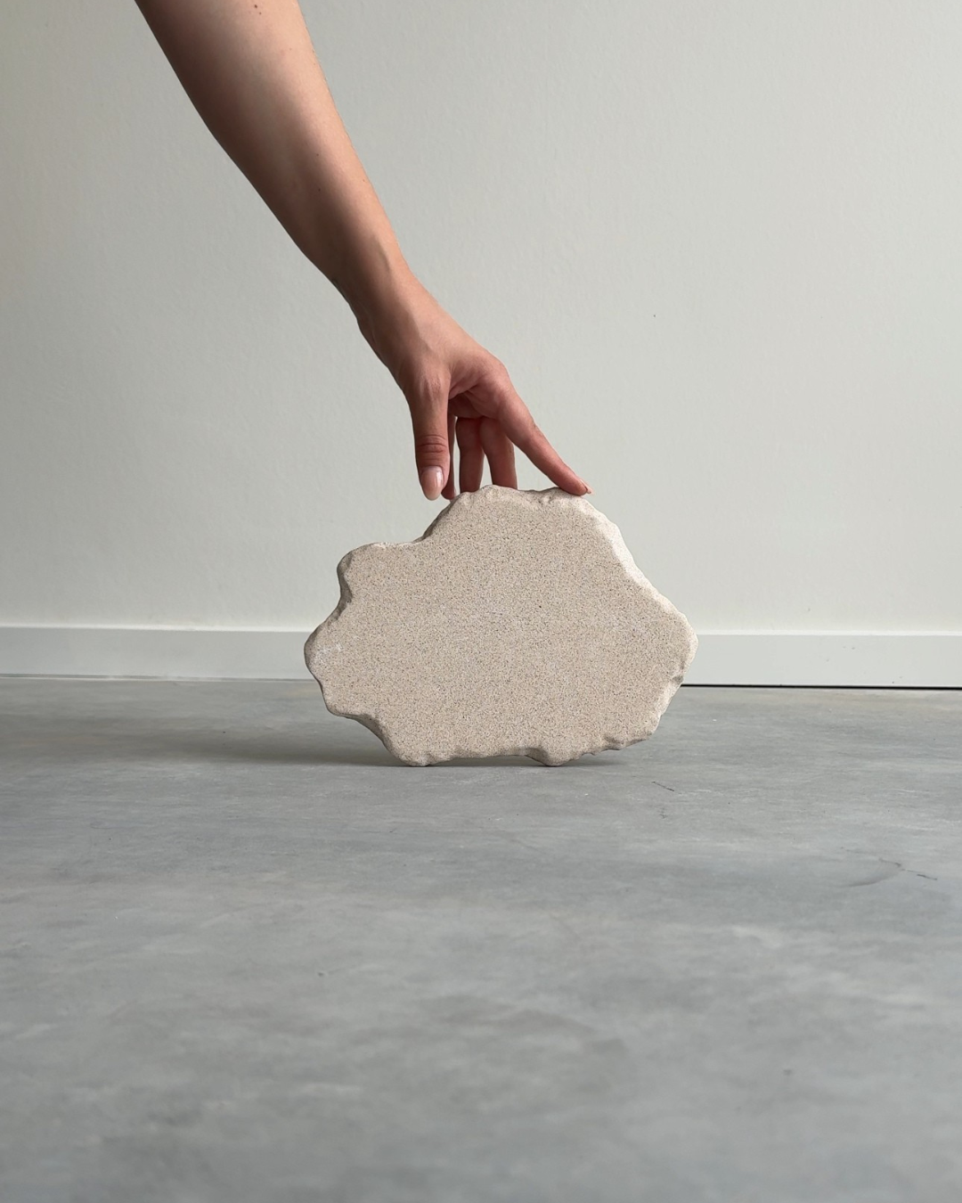 hand-poured micro concrete platter, minimalist serving tray, modern concrete decor, almond beige stone-look finish, versatile decorative tray for everyday objects, functional home decor piece, stylish tray for living room or office, high-quality concrete home accessories, sculptural centerpiece for table or countertop, eco-friendly concrete tray, premium quality home decor, unique serving platter for kitchen or dining room, handmade tray, organization, bold decorative piece for modern homes, ginaladeco