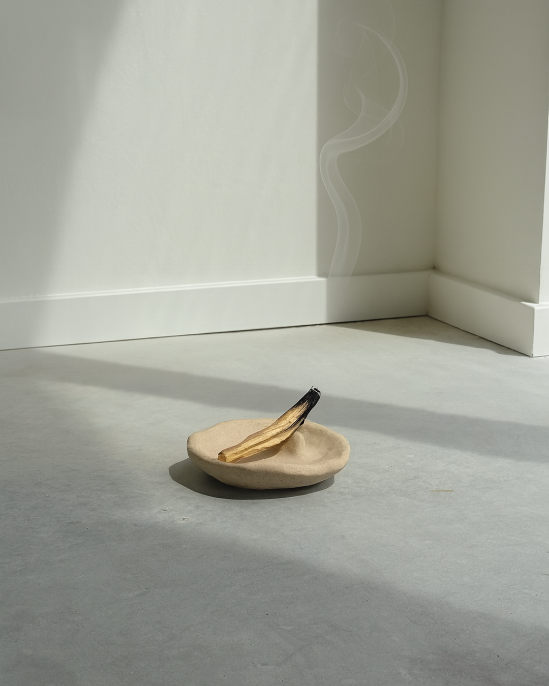 hand-poured micro concrete palo santo dish, modern stone-look finish, minimalist decor for palo santo burning, functional and sculptural home decor, almond beige color, elevated rest for palo santo stick, eco-friendly concrete dish, unique incense holder, contemporary decor for living room or meditation space, high-quality concrete home accessory, handmade dish for spiritual practices, versatile decorative object, premium concrete art piece, stylish and functional gift for wellness lovers, ginaladeco