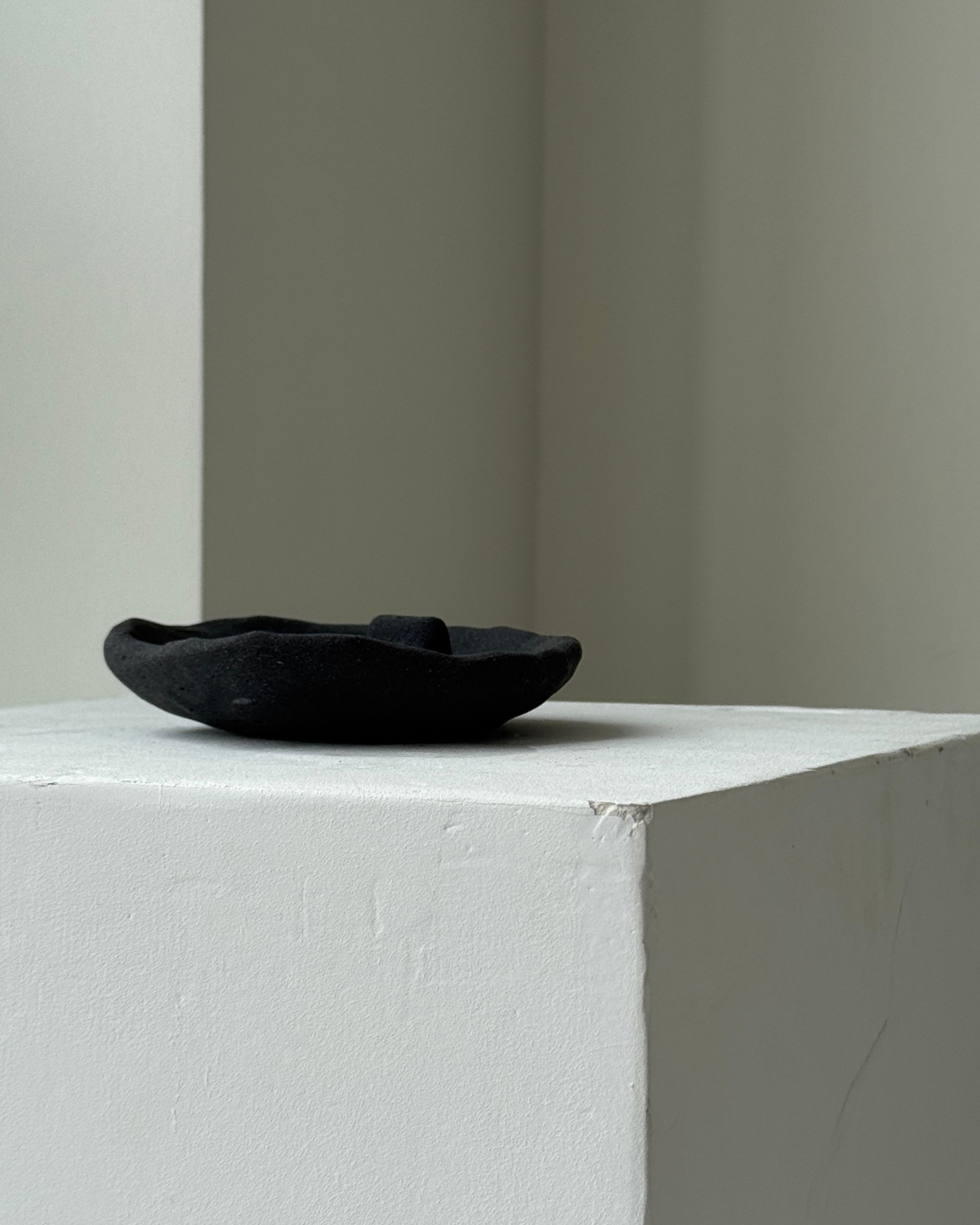 hand-poured micro concrete palo santo dish, modern stone-look finish, minimalist decor for palo santo burning, functional and sculptural home decor, almond beige color, elevated rest for palo santo stick, eco-friendly concrete dish, unique incense holder, contemporary decor for living room or meditation space, high-quality concrete home accessory, handmade dish for spiritual practices, versatile decorative object, premium concrete art piece, stylish and functional gift for wellness lovers, ginaladeco