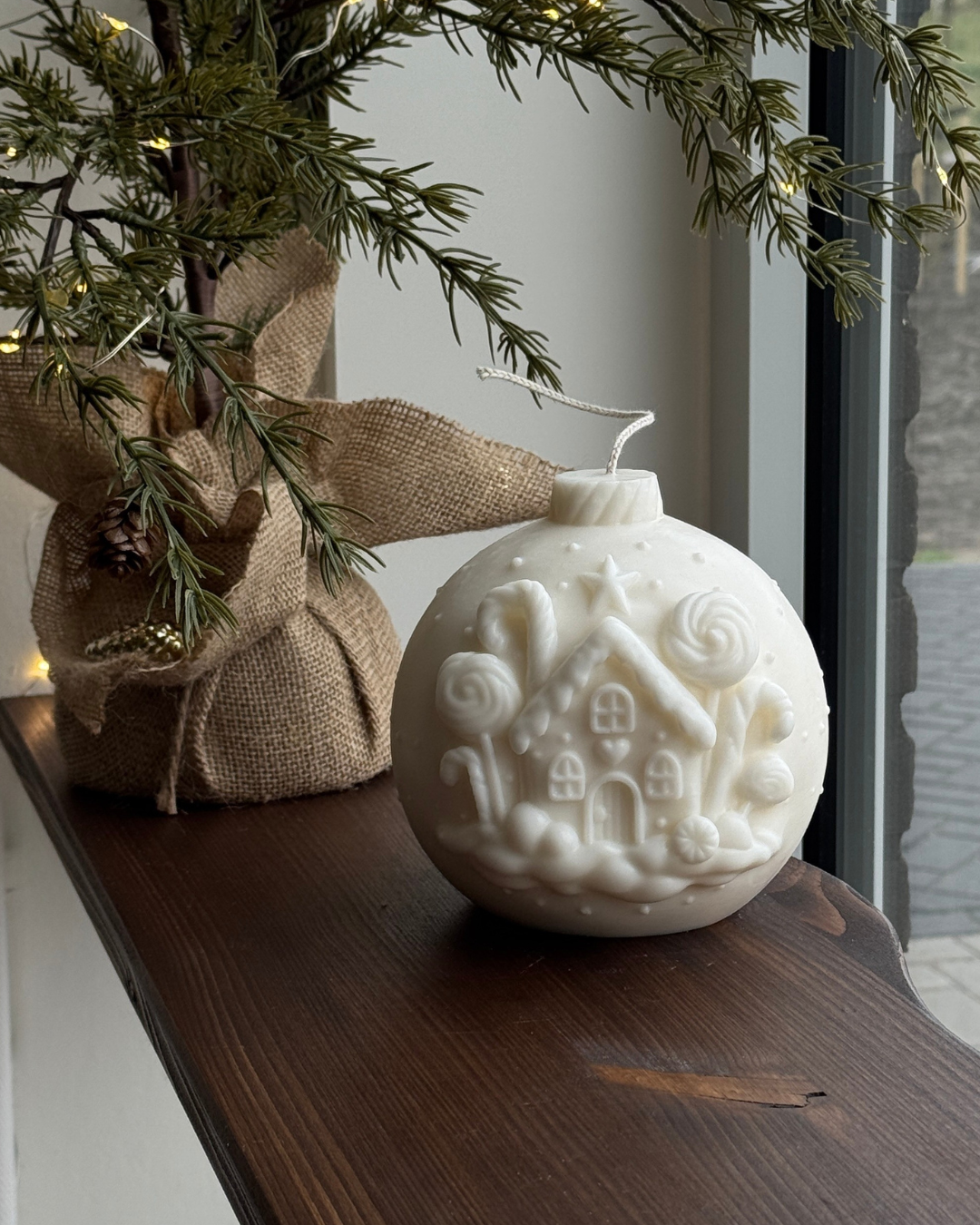 xl bauble candle, christmas bauble candle, ivory ornament candle, large decorative candle, festive bauble candle, winter bow candle, unscented christmas candle, sculptural holiday candle, white bauble candle, statement holiday candle