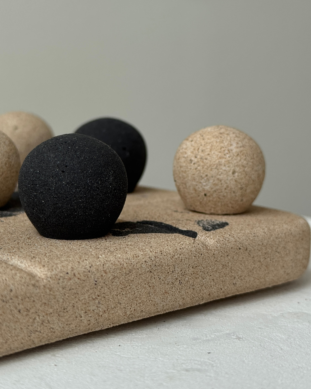 hand-poured micro concrete tic tac toe game, modern concrete decor, playful design object, sculptural home accent, beige and black marble finish, unique desk or living room decor, functional decorative piece, minimalist game board for home, stylish table decor, high-quality concrete accessories, sustainable and eco-friendly design, contemporary decor for adults, premium home decor, interactive home decor for play and pause moments, handmade decorative game, unique gift idea, ginaladeco
