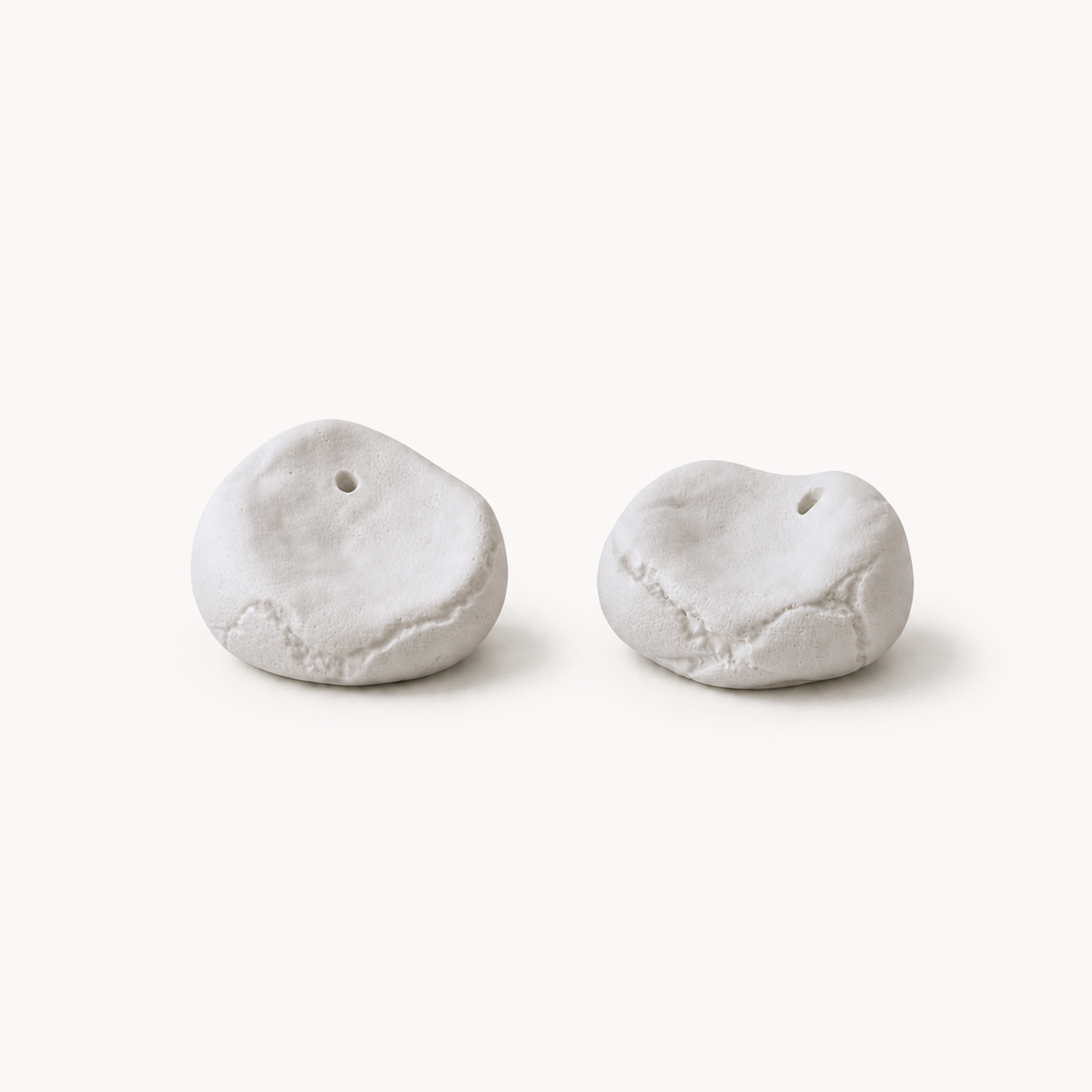 minimalist interior, white roses, ceramic vases, handmade decor, pebble vases, sculptural objects, wooden shelf, window light, sunlight shadows, neutral tones, aesthetic decor, soft natural light, floral arrangement, modern home, calm atmosphere, windowsill styling, organic shapes, artisanal pottery, natural materials, simple living, serene space, cozy corner, contemporary design, clean aesthetic, still life, home styling